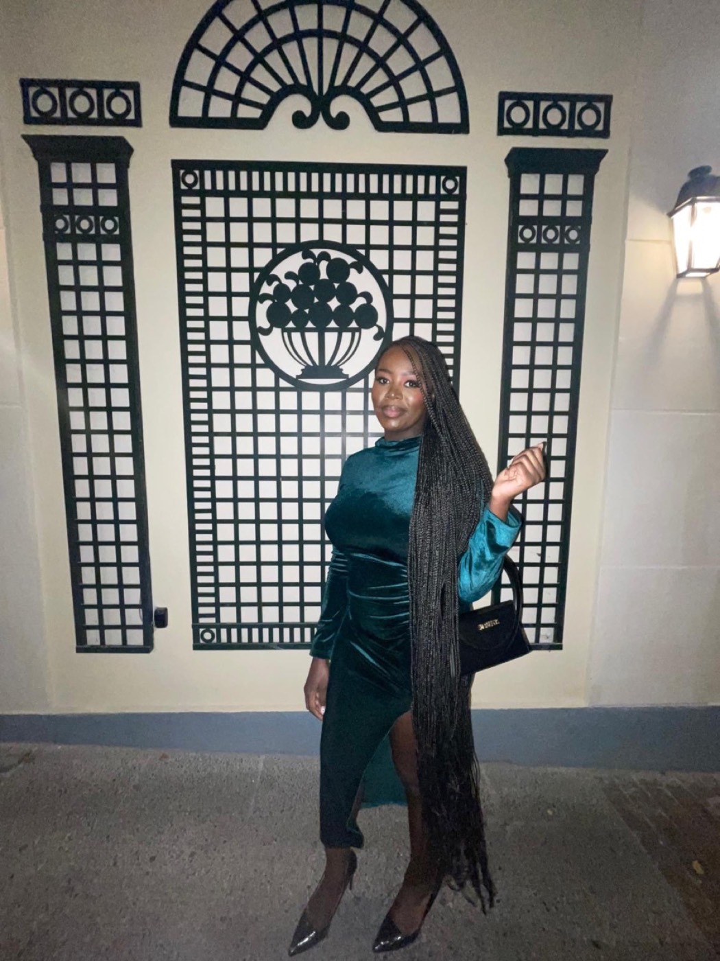 Floor-length knotless braids styled for an evening look